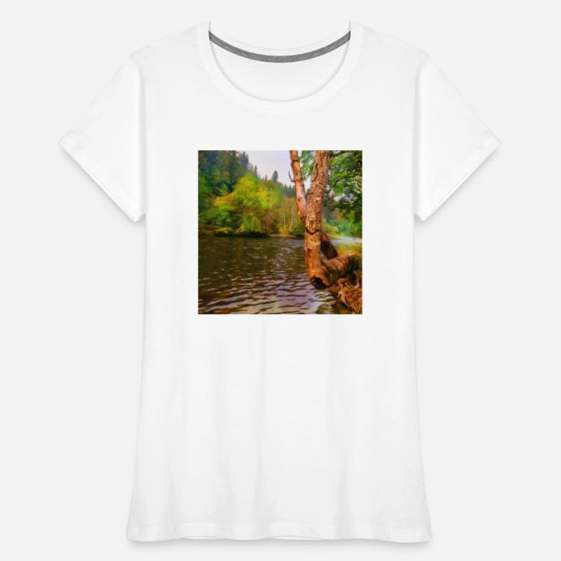 large tree growing over river bank